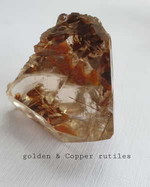 Amphibole Quartz facet cut freeform with rutiles