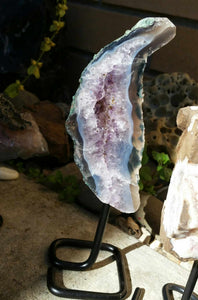 Amethyst geode slab - caoxinite inclusions - on stand